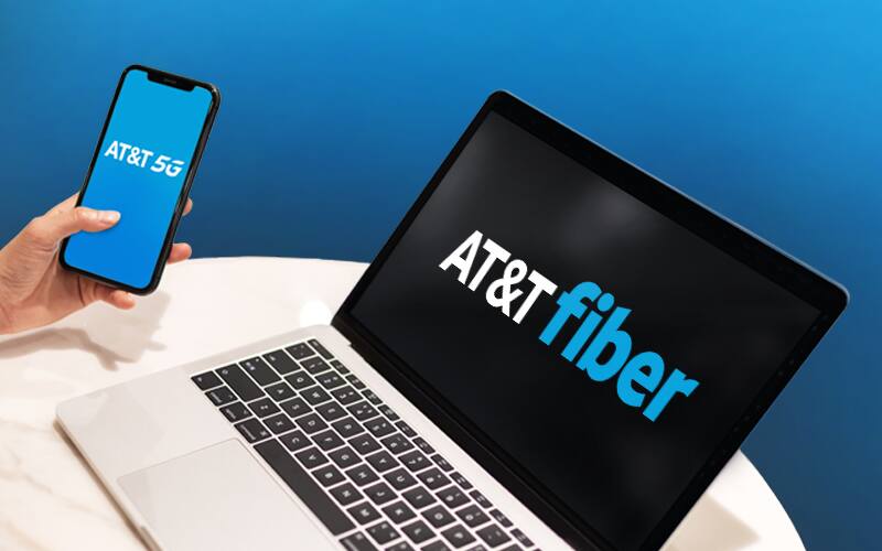 Holding a phone and watching laptop