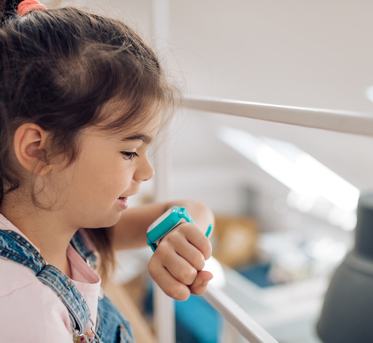 kid looking at smart watch.