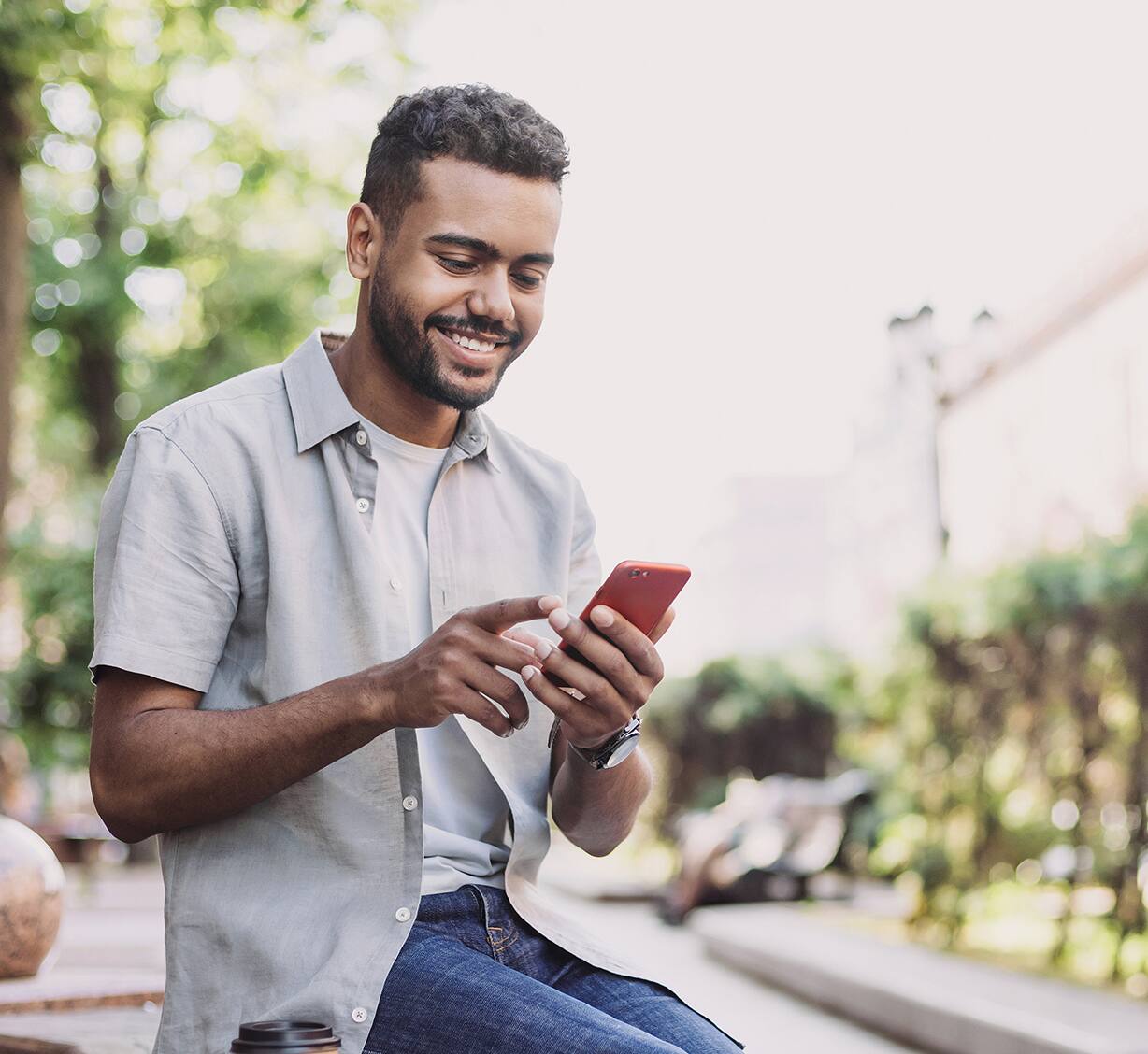 A guy holding his cellphone