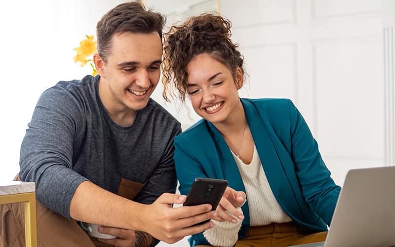 Men and women looking at phone